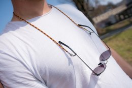 Colorful glasses strap with Gryffindor house design, made of durable material for sunglasses or eyeglasses.