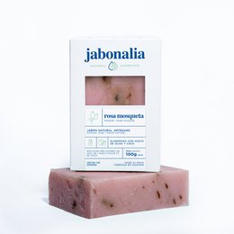 Rosehip soap bar with natural ingredients, including rosehip oil. Rectangular shape with a pale pink color.