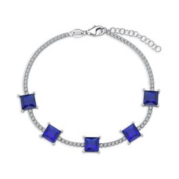Elegant silver-tone charm bracelet with square-cut blue gemstones and sparkling crystal accents. Suitable for casual or formal wear.