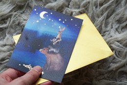 Hanging up Christmas card stars with foil stamping