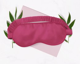 Luxurious 100% silk sleep mask in a rich wine color, perfect for a restful night's sleep.
