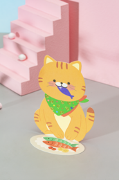 Colorful 3D mini map card with a cute cartoon cat design. The cat has a green scarf and is sitting on a pink background with geometric shapes.