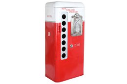  A tall, red metal bottle rack with a worn, vintage appearance. The rack has multiple slots to hold bottles or other cylindrical items. The design features a classic, industrial style.