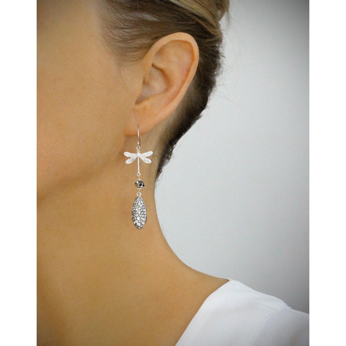 Rhodium plated dragonfly earrings with grey crystal drops