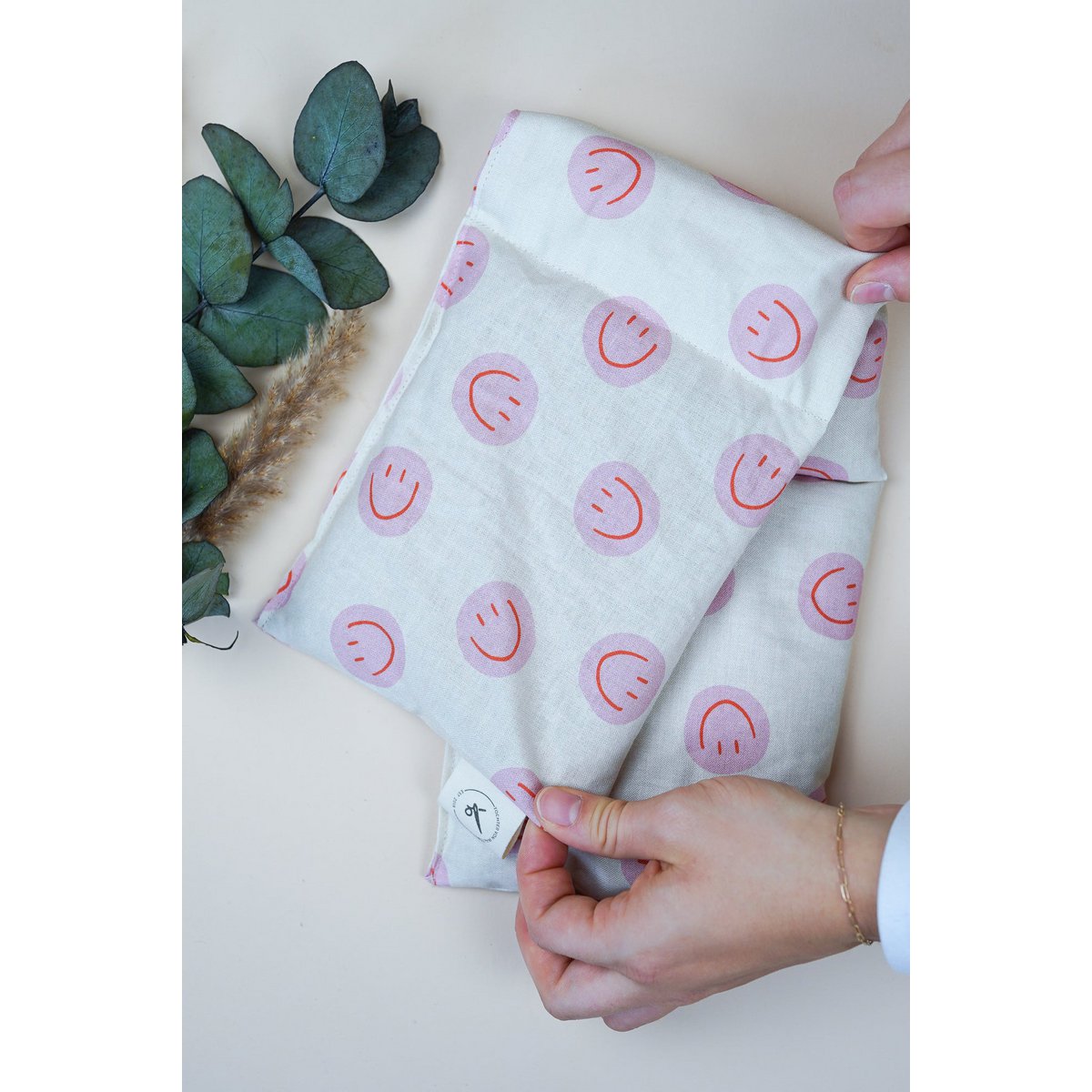 Katoenen warmtekussen gevuld met biologische spelt Smiley Pink