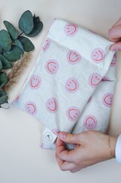 Pink smiley face pattern cotton heat pad, organic spelled filling, soft fabric pillow.