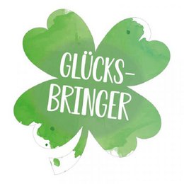 Green shamrock-shaped magnet with the text "Glücksbringer" (lucky charm)