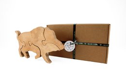 Wooden puzzle boar toy for kids, made of natural wood, with puzzle pieces in the shape of a boar.
