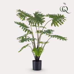 Artificial plant - Philodendron - 100 cm. Green, lush, tropical-looking plant with large, feathery leaves in a black pot.