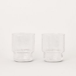 Clear glass tumblers, set of 2, suitable for water or other beverages.