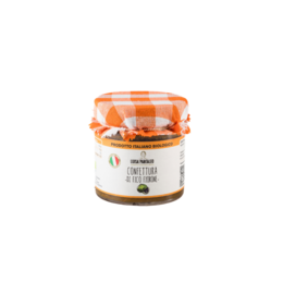 Organic fig jam made in Italy, with a sweet and tangy flavor, in a glass jar with an orange and white checkered lid.