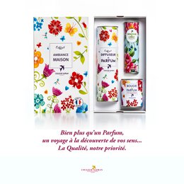 A gift box containing a perfume diffuser, soft linen, and a handmade candle, all made in Grasse, France. The box features a colorful floral design with various flowers and patterns.

The product description includes the following details:
- Colors: Vibrant floral patterns with red, blue, yellow, and green colors
- Materials: Perfume diffuser, soft linen, and handmade candle
- Style: Chic, elegant, and floral
- Shape: Rectangular gift box

This product would be suitable for a semantic search for terms like "floral", "perfume", "candle", "gift set", and "Grasse".