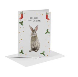 A6 size Christmas card featuring a hand-painted rabbit illustration with the text "Have a very hoppy Christmas!" The card has a festive design with holly and red birds.