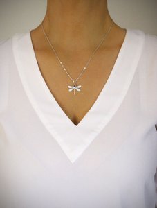 Medium-length rhodium plated dragonfly and Tanzanite necklace