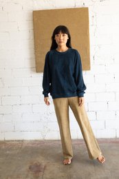 Navy blue raglan sleeve sweatshirt with relaxed fit.