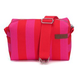  Camouflage crossbody bag with adjustable strap and leather accent. Suitable for carrying essentials on the go.