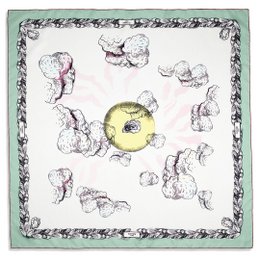 A silk scarf with a vibrant yellow oyster design surrounded by delicate floral patterns in shades of green and pink. The scarf has a luxurious, high-quality feel and would make a stylish accessory for any outfit.