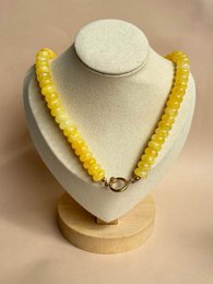 Yellow beaded necklace, chunky round beads, gold-tone clasp, statement jewelry.