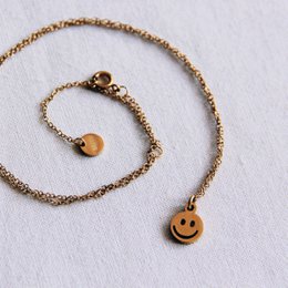 Cadena fina de acero inoxidable con smiley - oro