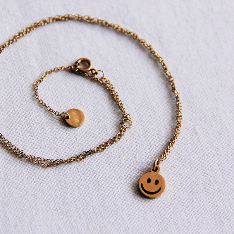 Cadena fina de acero inoxidable con smiley - oro