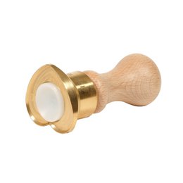 Heart-shaped brass ravioli-cutting mold for making homemade pasta. Features a wooden handle and brass cutting edge for precise ravioli shaping.