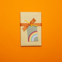 Set of 5 colorful gift tags with "Rainbow" design. Made of sturdy cardstock material. Vibrant rainbow colors including green, yellow, orange, pink, and blue. Ideal for gift wrapping, party favors, or decorative use.