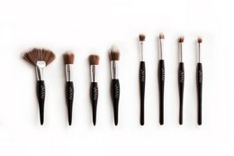 8-piece professional black makeup brush set with clutch, suitable for face makeup application.