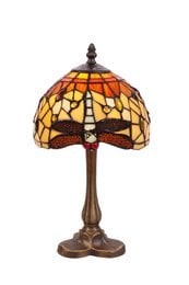 Tiffany-style table lamp with amber-colored glass shade featuring a dragonfly design, on a bronze-colored metal base.