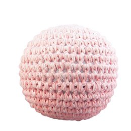 A soft, crocheted baby rattle in a faded pink color.