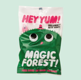 Organic gummies in a "Magic Forest" themed packaging, featuring a green creature with large eyes and the text "Hey Yum!"