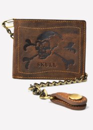 Vintage leather wallet with skull and crossbones design, featuring a chain strap and zipper closure. Suitable for casual or edgy fashion styles.