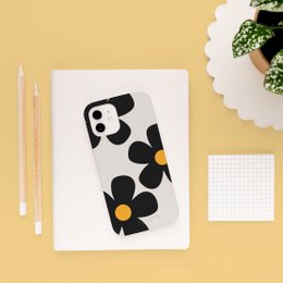 Eco-friendly iPhone case with white daisy flower design. Durable, lightweight, and stylish protection for your smartphone.