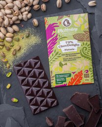 Dark chocolate 72% with pistachio pieces, premium artisan bar with nuts.