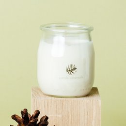 Clear glass candle with Norwegian Mist and Forest Pine scents, soy wax, pine cone accents.