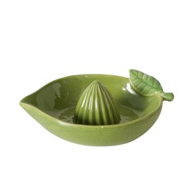  A green citrus juicer with a leaf-shaped design, suitable for squeezing limes or other small citrus fruits.