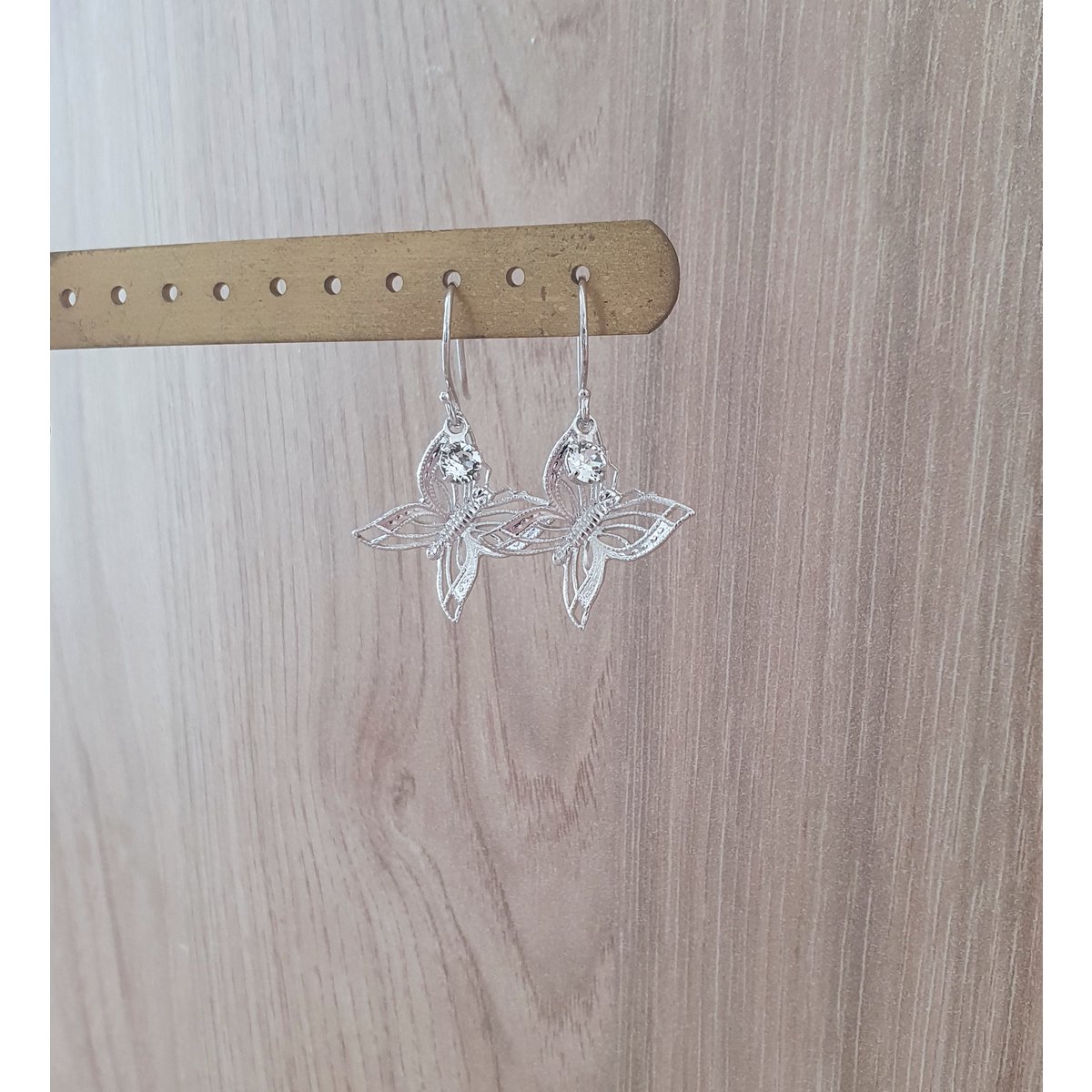 Rhodium plated butterfly earrings with charms