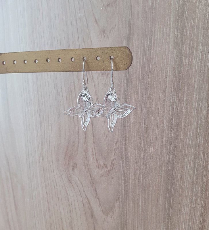 Rhodium plated butterfly earrings with charms
