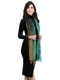 Multicolored wool scarf with a soft, flowing texture and a sustainable, fair-trade production process.