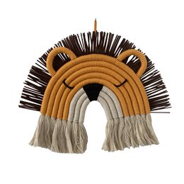 Decorative wall hanging featuring a lion design with a textured, woven appearance in shades of yellow, brown, and white. The design includes curved shapes and fringe elements, creating a stylized, abstract representation of a lion.