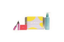 A gift box containing a bold blush, lengthening mascara, and H2O free cleanser. The box is yellow and white in color.