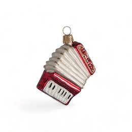 Decorative accordion-shaped ornament with a red and white color scheme, featuring a keyboard design.