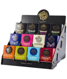 A wooden display stand featuring 12 bars of Willie's Cacao chocolate in various flavors. The stand showcases the brand's logo and the different chocolate varieties available, including dark, milk, and flavored options.