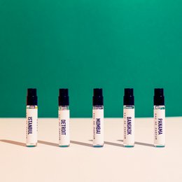The product is a perfume called "MUMBAI - Eau de Parfum" from the "Sober" and "Spicy" fragrance lines. The image shows several small bottles of the perfume against a green background. The description should focus on the key details that would be relevant for a semantic search, such as the fragrance name, type (eau de parfum), and the fact that it is part of a "Sober" and "Spicy" fragrance collection.
