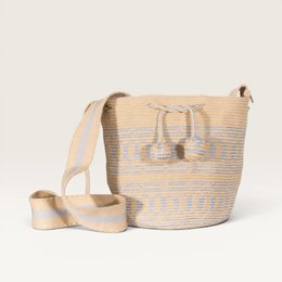 Woven straw crossbody bag, natural beige with blue geometric stripes, tassel details, shoulder strap.