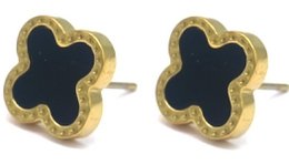 Stainless steel clover-shaped earrings with black enamel accents.