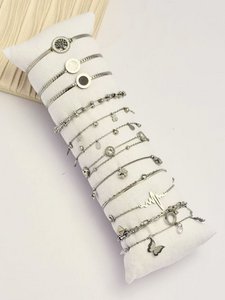 Set of 12 varied steel silver bracelets sold on display