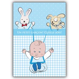 A baby card featuring a cute baby boy and two playful animal characters on a blue and white gingham background. The card has a French-inspired design with the text "Un petit garçon! Source joie!" which translates to "A little boy! Source of joy!"
