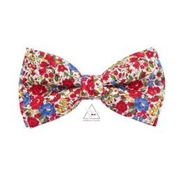 Floral and animal print bow tie with coral accents, suitable for formal or casual wear.