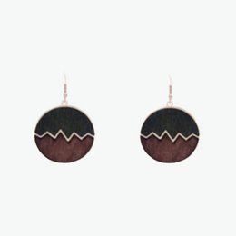 Wooden earrings with a moon-shaped design in a dark brown and black color scheme. The earrings feature a round shape and a simple, minimalist style.