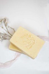 Organic, all-soft baby and mom soap bar with a sun-shaped design.